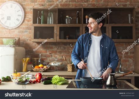 Happy Man Cooking Delicious Healthy Food Stock Photo 1075451507