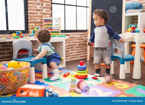 Two Kids Playing With Toys At Kindergarten Stock Photo Image Of