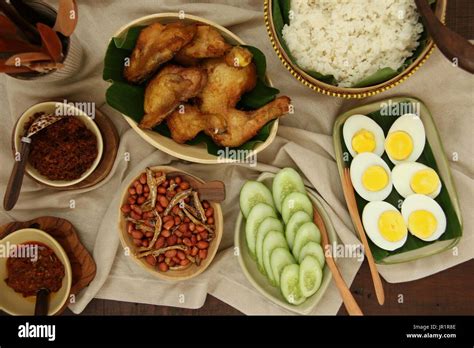 Nasi Lemak Malaysian Savory Rice Dish With Fried Chicken Egg Peanuts