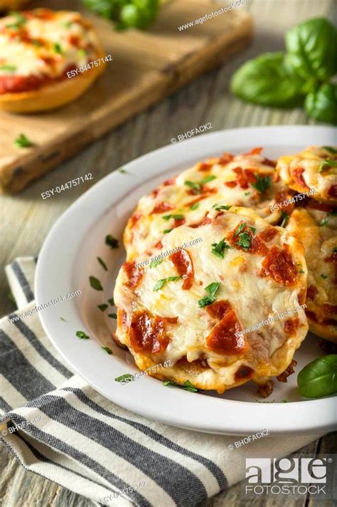 Homemade Pepperoni Mini Pizza Bagels With Basil Stock Photo Picture