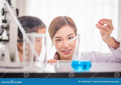 Elementary Science Class Cheerful Kid Girl With Teacher Scientist In