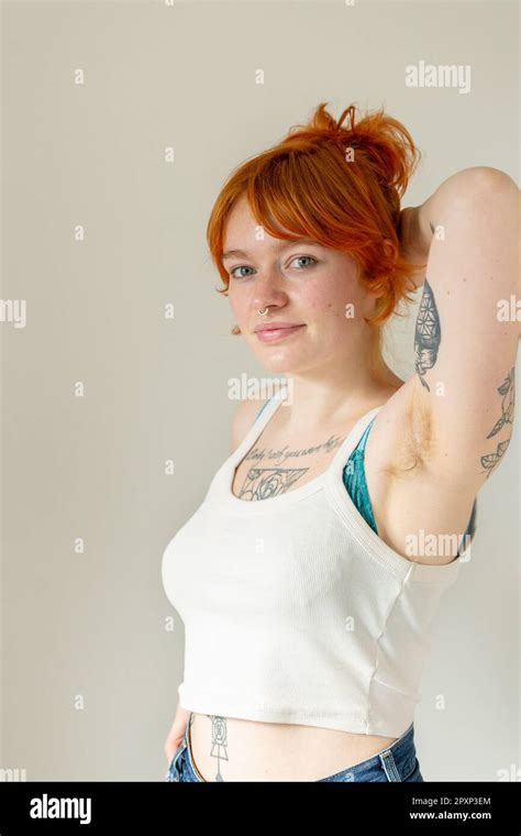 A Woman In Her Mid Twentys With Dyed Ginger Hair Tattoos And And Nose