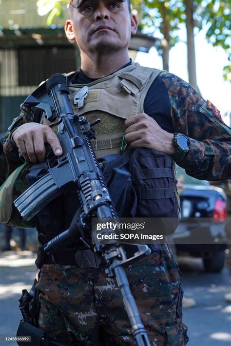 A Soldier Stands Guard At A Checkpoint Police And Military Perform A