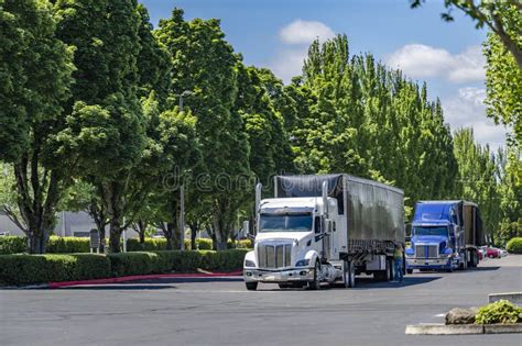 Team Of Two Big Rig Semi Trucks With Tented Conestoga Flat Bed Semi