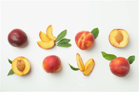 Premium Photo Ripe Peach Fruits With Leaves On White Background