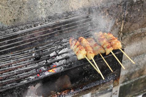 Pork Cook On The Bar B Que Grill In Thai Style With Fire Smoke Stock