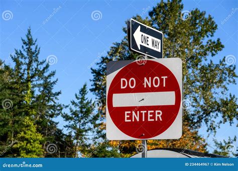 Closeup Of Red Do Not Enter Sign And One Way Sign On A Sunny Day