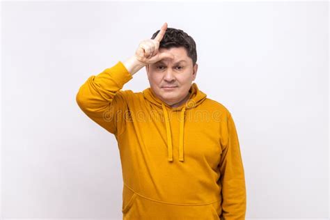 Depressed Man Showing Looser Gesture Holding Fingers Near Forehead Sad Because Of Silly Mistake