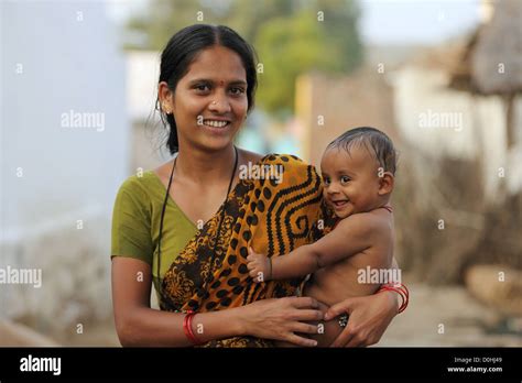 Indian mother holding her baby son Andhra Pradesh South India Stock ...