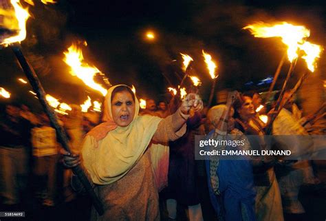 Bhopal gas leak victims march hold torches and shout slogans against... News Photo - Getty Images