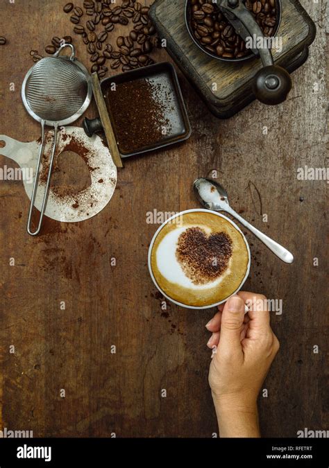 Photo Of A Messy Rustic Wooden Table Of Coffee Beans Grinder And A