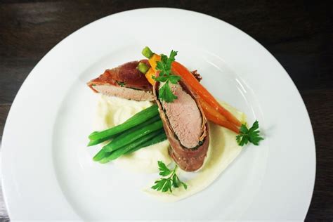 Pork Fillet Wrapped In Prosciutto Cauliflower Puree Honeyed Carrots And Green Beans Dinner