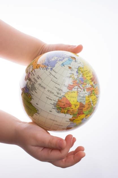 Premium Photo Cropped Hands Holding Globe Against White Background