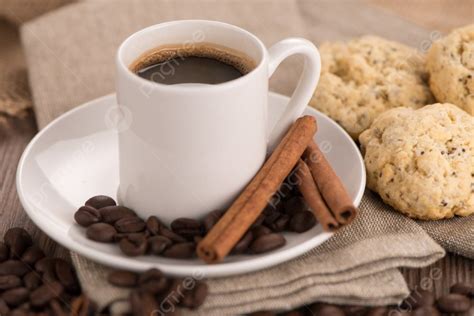 Coffee Cup With Burlap Sack Of Roasted Beans On Rustic Table Photo