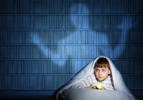 Boy Under The Covers With A Flashlight Stock Photo Image Of Darkness