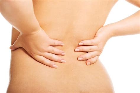 Premium Photo Rear View Of Naked Woman With Hands On Back Against White Background