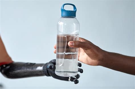 Premium Photo Couple Refreshing With Bottle Of Water