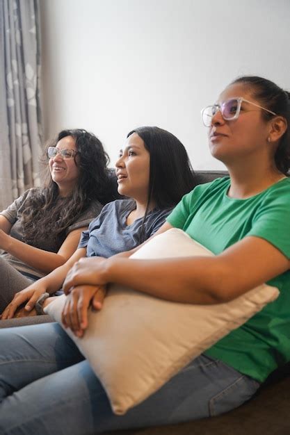 Premium Photo Three Latin Women Watching Tv