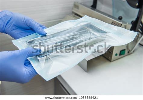 Close Dentist Assistants Hands Holding Packaged Stock Photo 1058566421