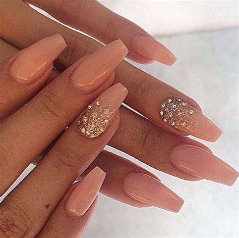 Acrylic Nude Nails With Glitter And Gems On The Ring Finger Need To