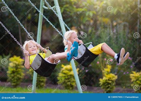 Child Swinging On Playground Kids Swing Stock Image Image Of Ground