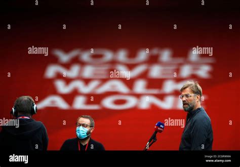 Liverpool Manager Jurgen Klopp Right Is Interviewed Before The Premier League Match At Anfield