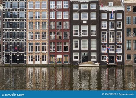 Facades Of Traditional Colorful Dutch Houses In Amsterdam Holland