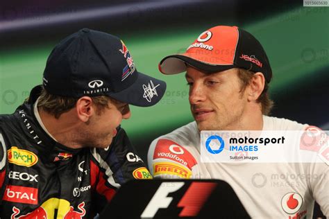 Sebastian Vettel Ger Red Bull Racing And Jenson Button Gbr Mclaren