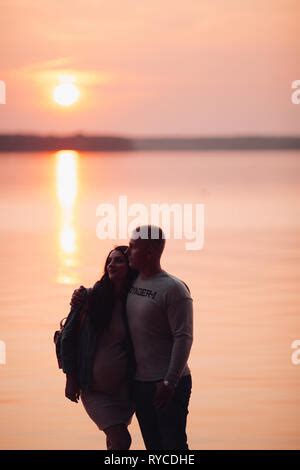 Beautiful Brunette Wife Embracing Beloved Husband With Small Kid Sitting On Dad S Shoulders And