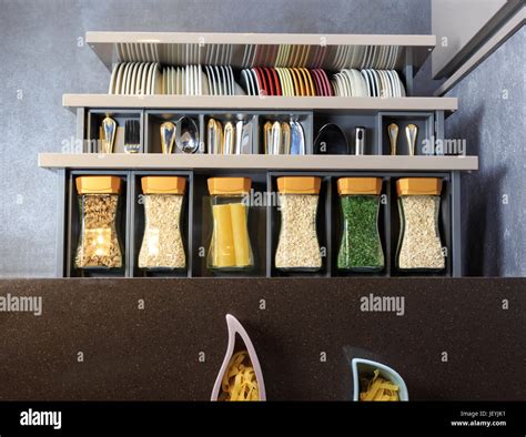 Modern kitchen countertop with food ingredients. Top view of drawers ...