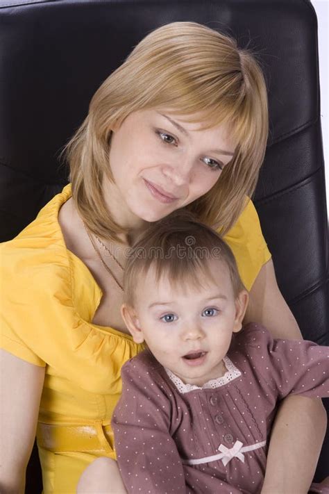 Mother And Daughter Sitting In A Chair Picture Image 9795402