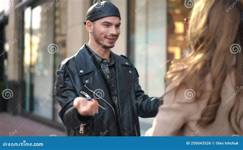 Happy Gay Man Hugging Woman On City Street Talking Smiling Portrait Of