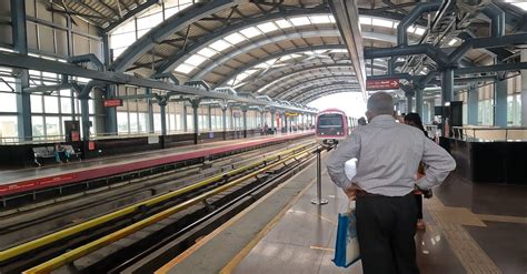 people waiting for the metro in bangalore metro station Free Stock ...