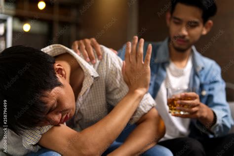 No More Alcohol Drunk Man Sitting On Sofa Refusing Whiskey From His