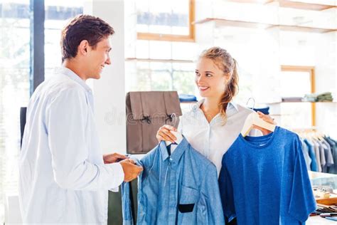 Shop Assistant Helping To Choose Clothes Stock Photo Image Of Casual