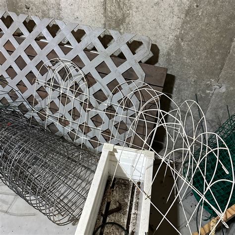 Assortment Of Outdoor Fencing Edging Tomato Cages Metal Wood Table