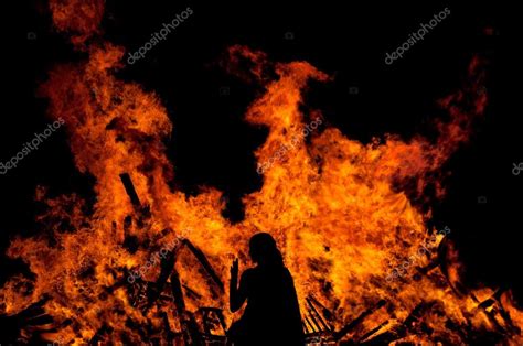 Woman Standing In Front Of Fire Stock Photo Dekanaryas