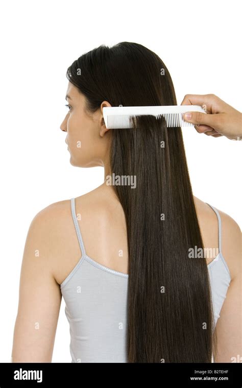 Woman Having Her Long Hair Combed Rear View Stock Photo Alamy