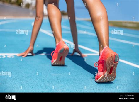 Sprinter Waiting For Start Of Race On Running Tracks At Outdoor Stadium Sport And Fitness