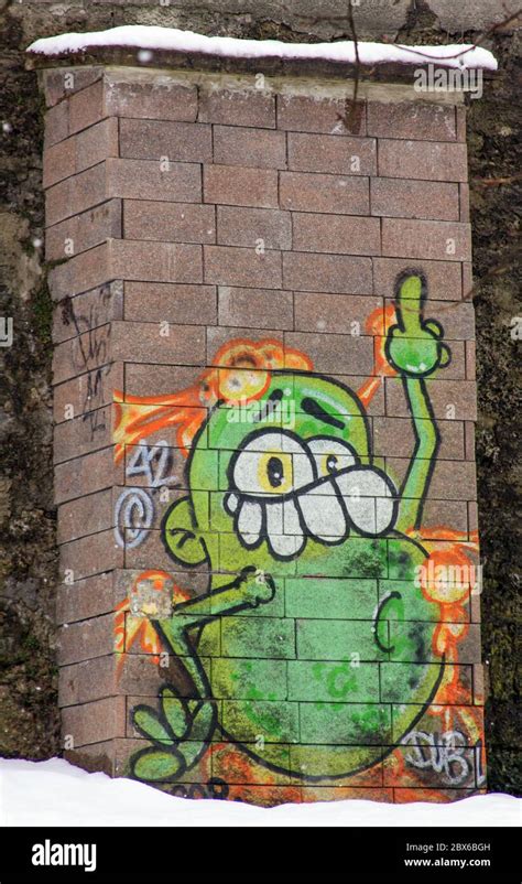 Funny green character graffiti painting on wall in Salzburg, Austria Stock Photo - Alamy