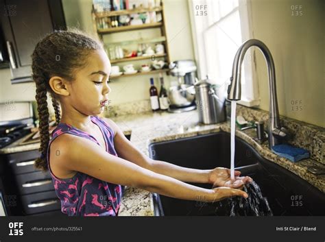 Washing Hands In Kitchen Sink Things In The Kitchen