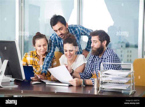 Group of happy creative people working in the office Stock Photo - Alamy