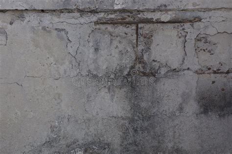 Textura De Piedra Oscura De Un Muro De Cemento Gris Imagen De Archivo