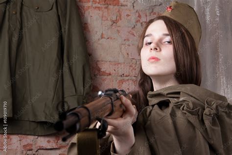 Woman In Russian Military Uniform Shoots A Rifle Female Soldier During