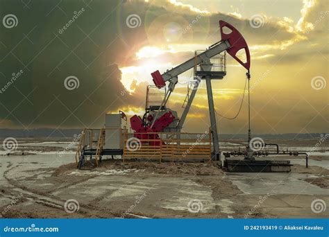 Crude Oil Pump Jack At Oilfield On Sunset Backround Fossil Crude