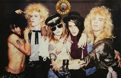 The Group Of Rockers Posing For A Photo