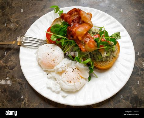 Lunch In A Caf Sourdough Toast Crushed Avocados Salad Two Poached Eggs