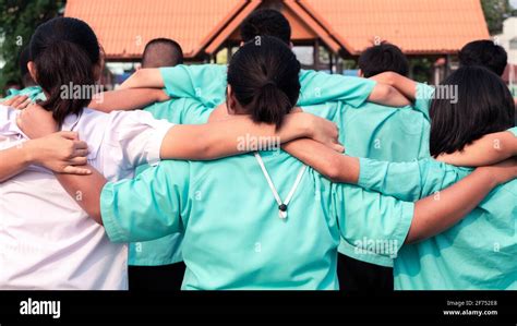 Concept of best friends,Teen group of uniform students hugging in school Stock Photo - Alamy