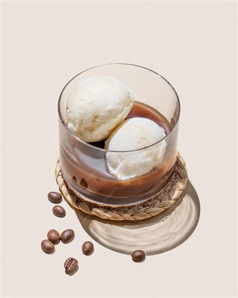 Premium Photo | Affogato coffee with vanilla ice cream scoops and