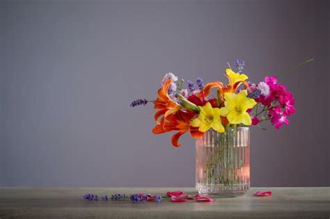 Premium Photo Summer Flowers In Glass Vase On Wooden Shelf